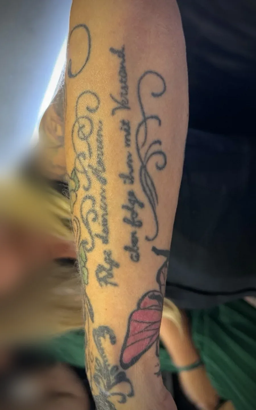 Old script tattoo before the cover-up